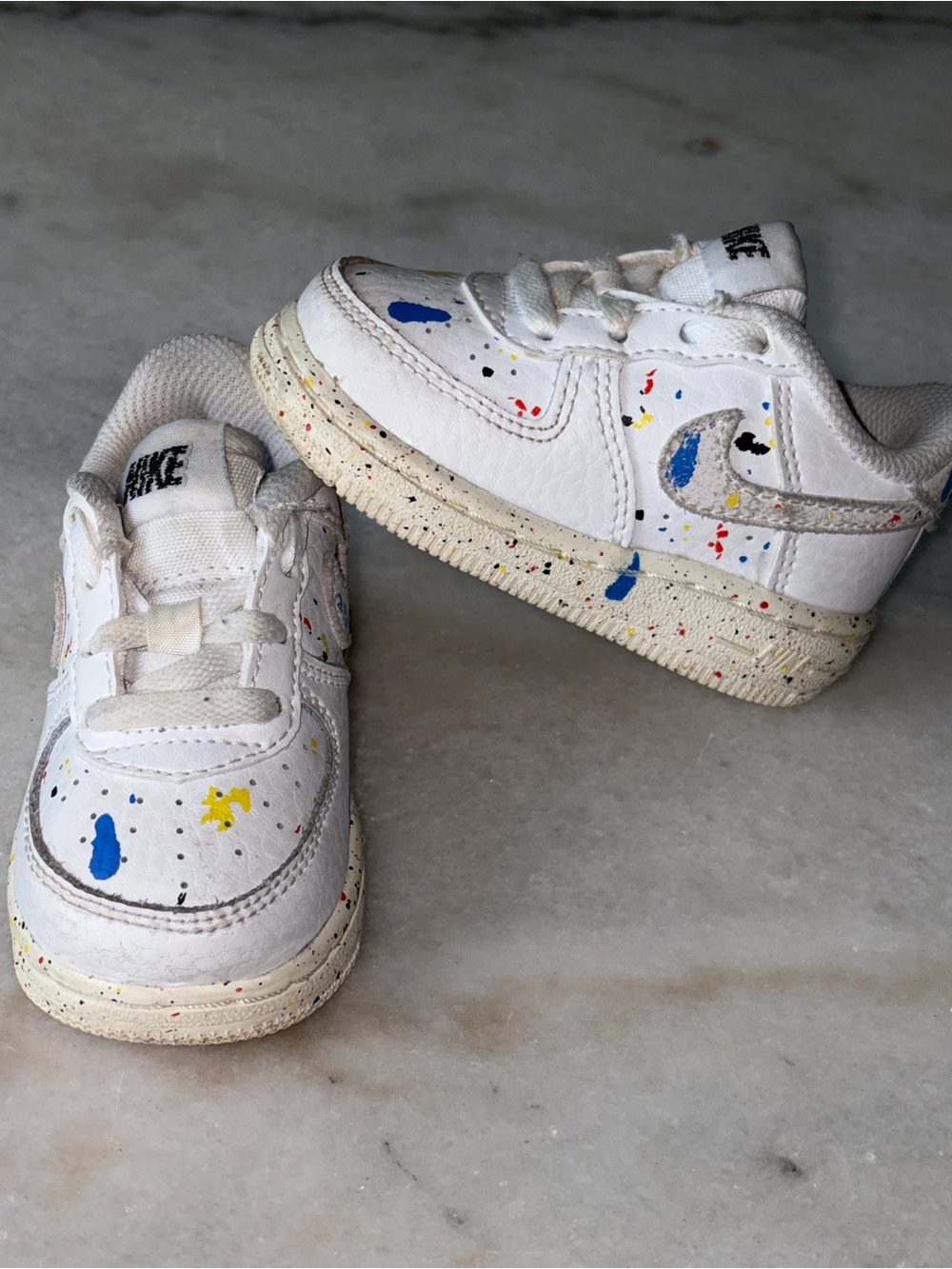 Nike Kids White Sneakers with Blue and Yellow Paint-Splatter